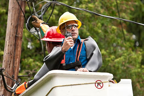Utility worker using radio