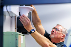 man working on device
